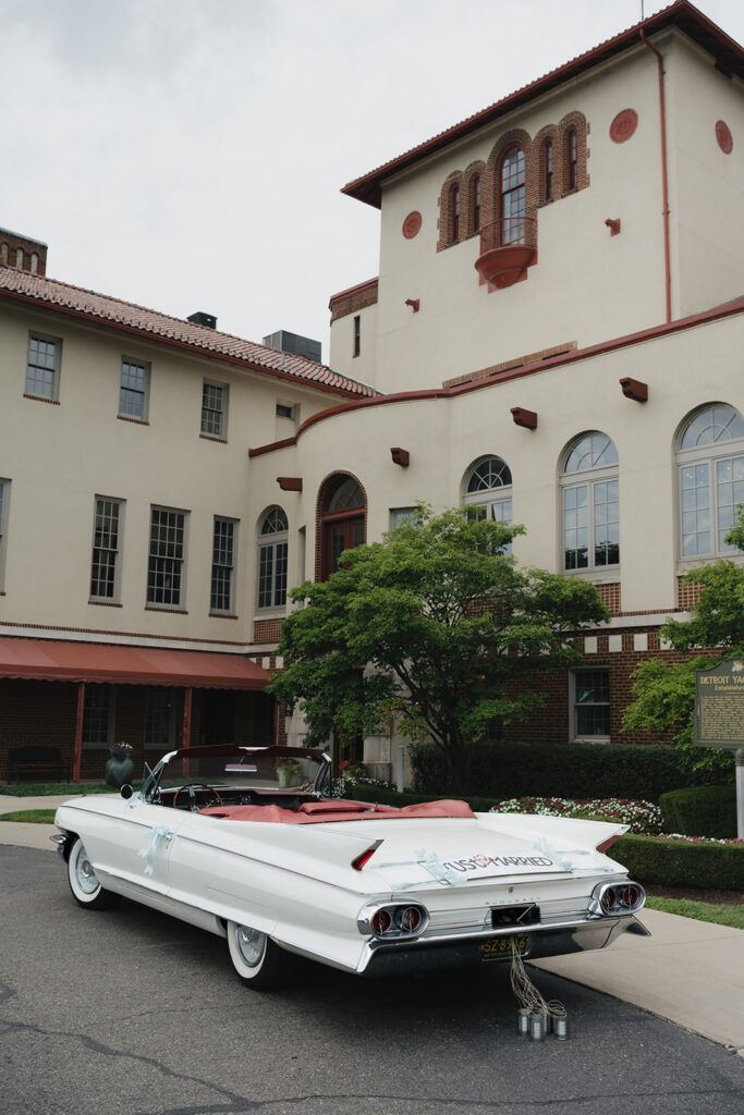 Vintage Eldorado parked in front of Detroit Yacht Club.