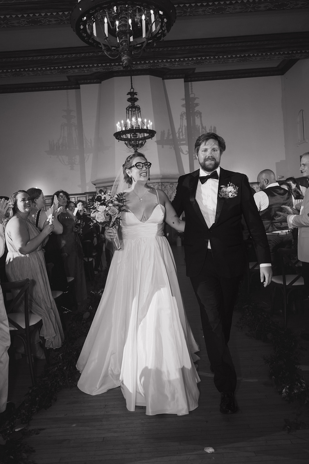 Bride and groom walking back down the aisle after ceremony at Detroit Yacht Club wedding as husband and wife.