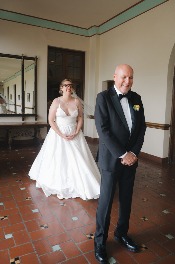 Bride about to share an emotional first look with her father.