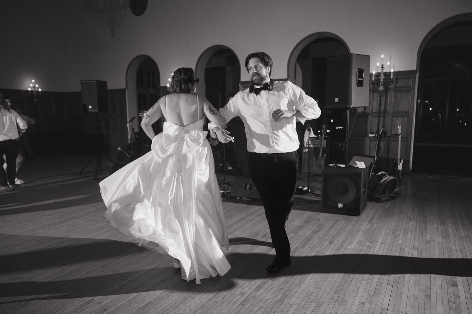 Black and white photo of a bride and groom dancing during their Detroit Yacht Club wedding reception.