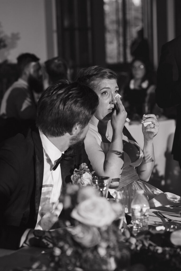 Bride getting emotional during speeches at Detroit Yacht Club.