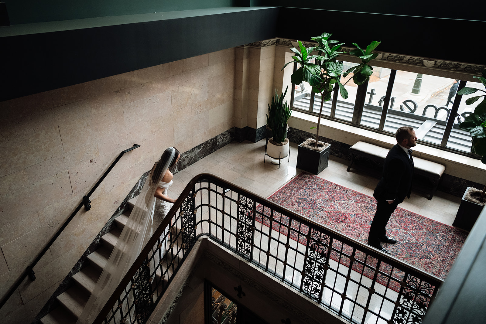Bride walking up the stairs for first look at Element by Westin Detroit.