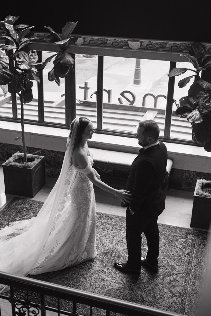 Black and white portrait of a bride and groom before sharing a first look at Element by Westin Detroit.