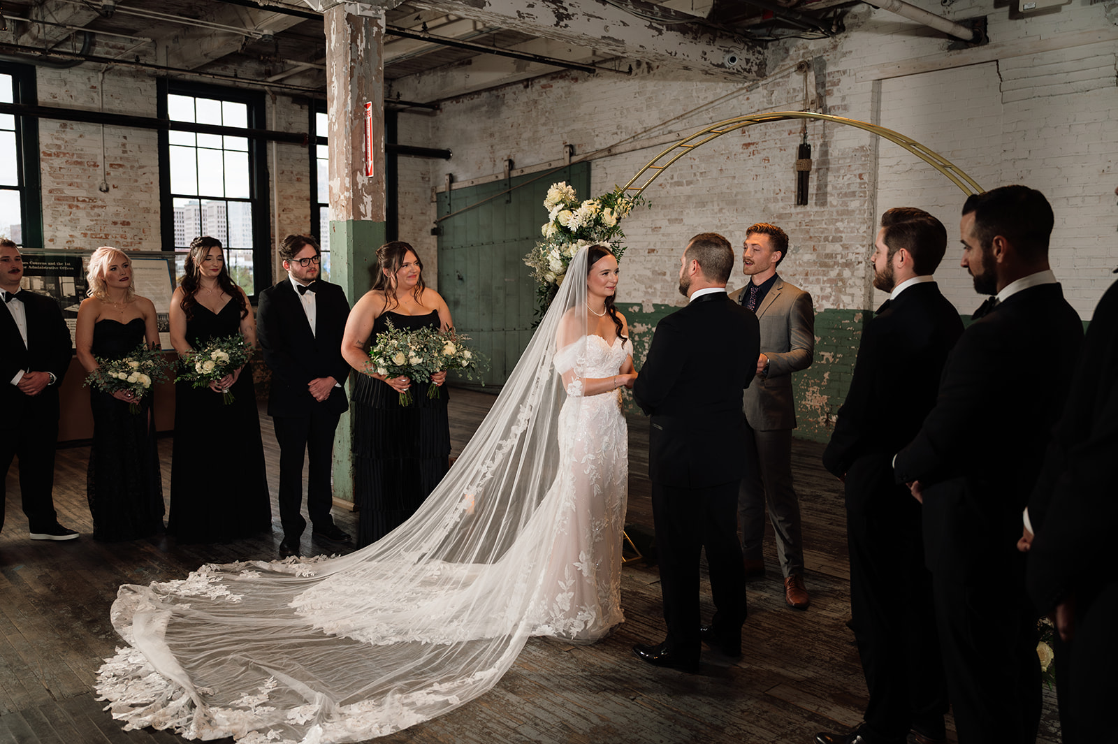Bride and groom exchanging vows during Ford Piquette Avenue Plant wedding.