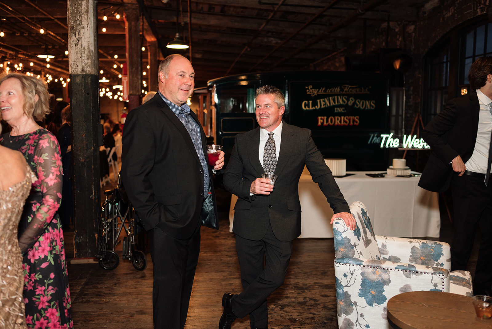 Guests holding drinks and socializing during cocktail hour at Ford Piquette Avenue Plant.