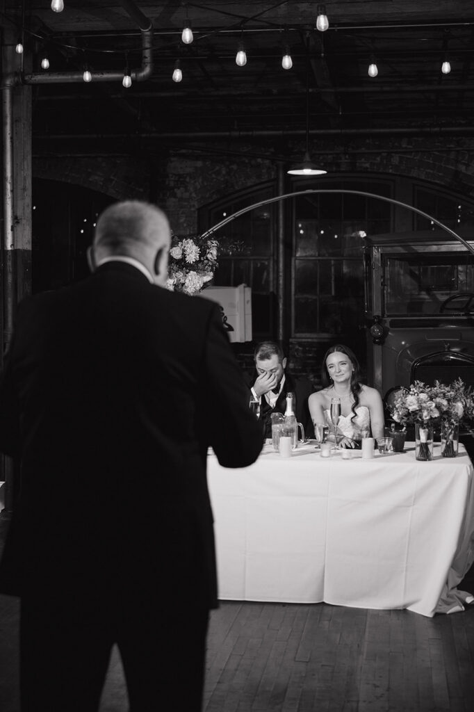 Father of the bride giving emotional speech during reception at Ford Piquette Avenue Plant wedding.