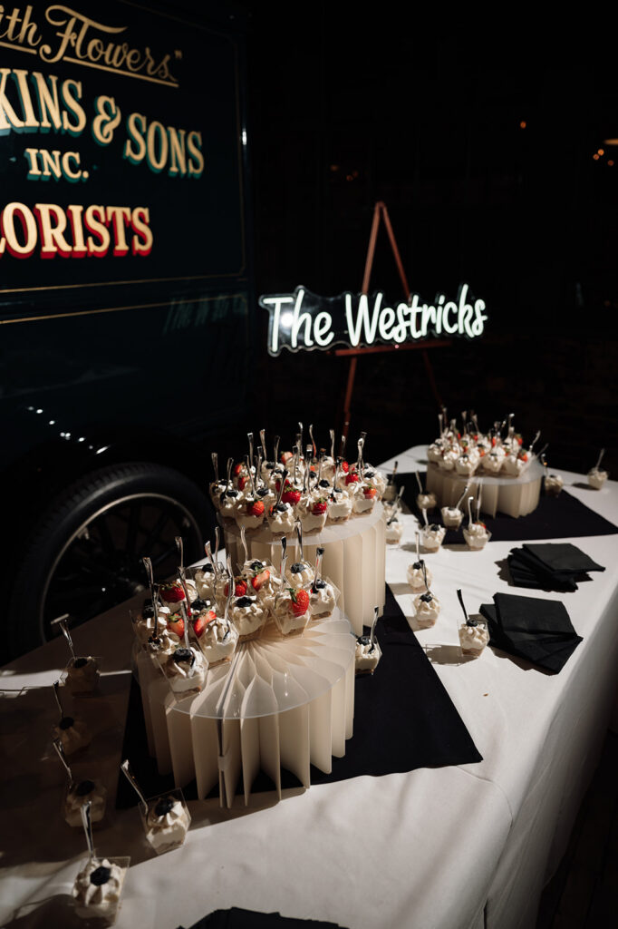 Dessert display with mini parfaits and sign reading “The Westricks” at Ford Piquette Avenue Plant reception.