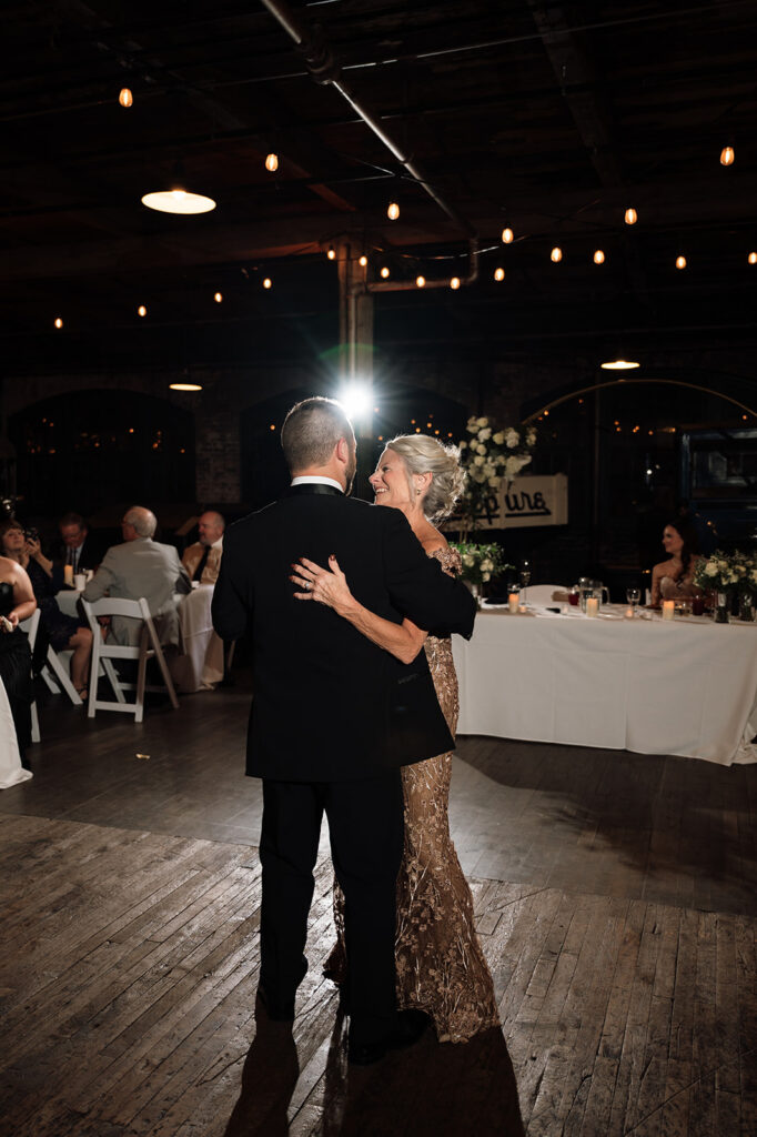 Groom sharing a dance with his mother.