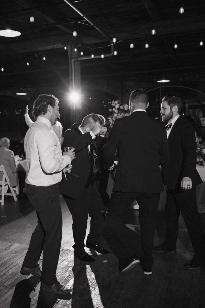 Black and white portrait of guests on the dance floor.