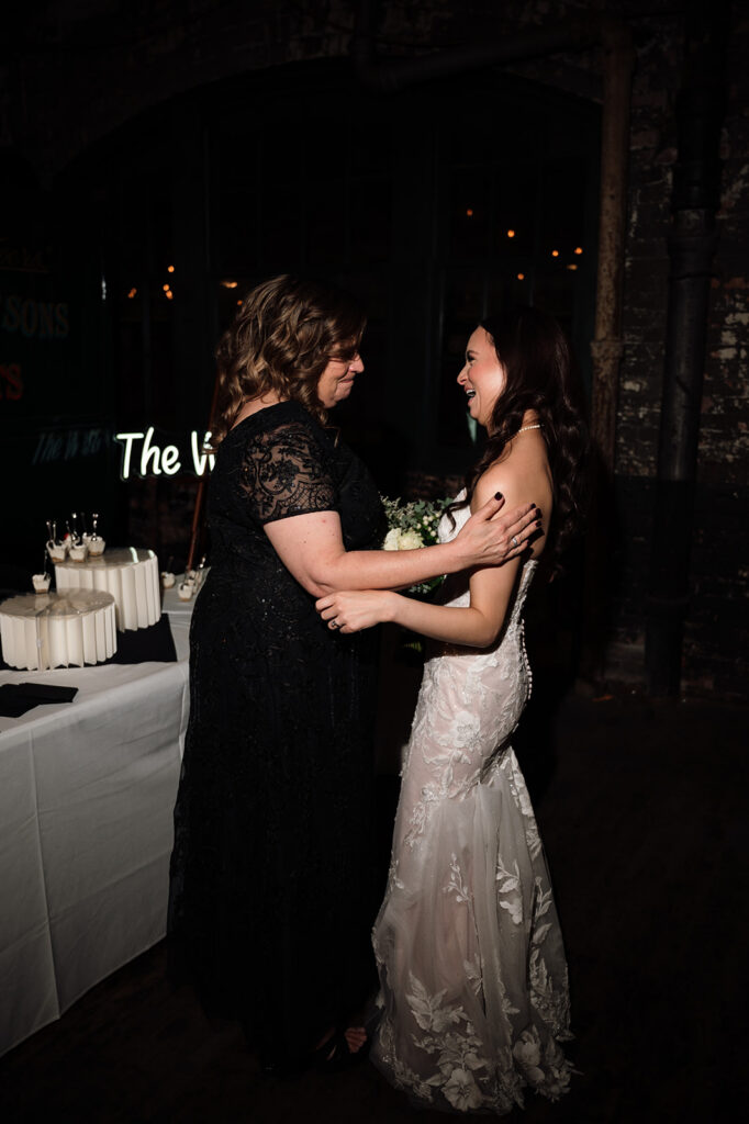 Bride hugging her mother during the reception.