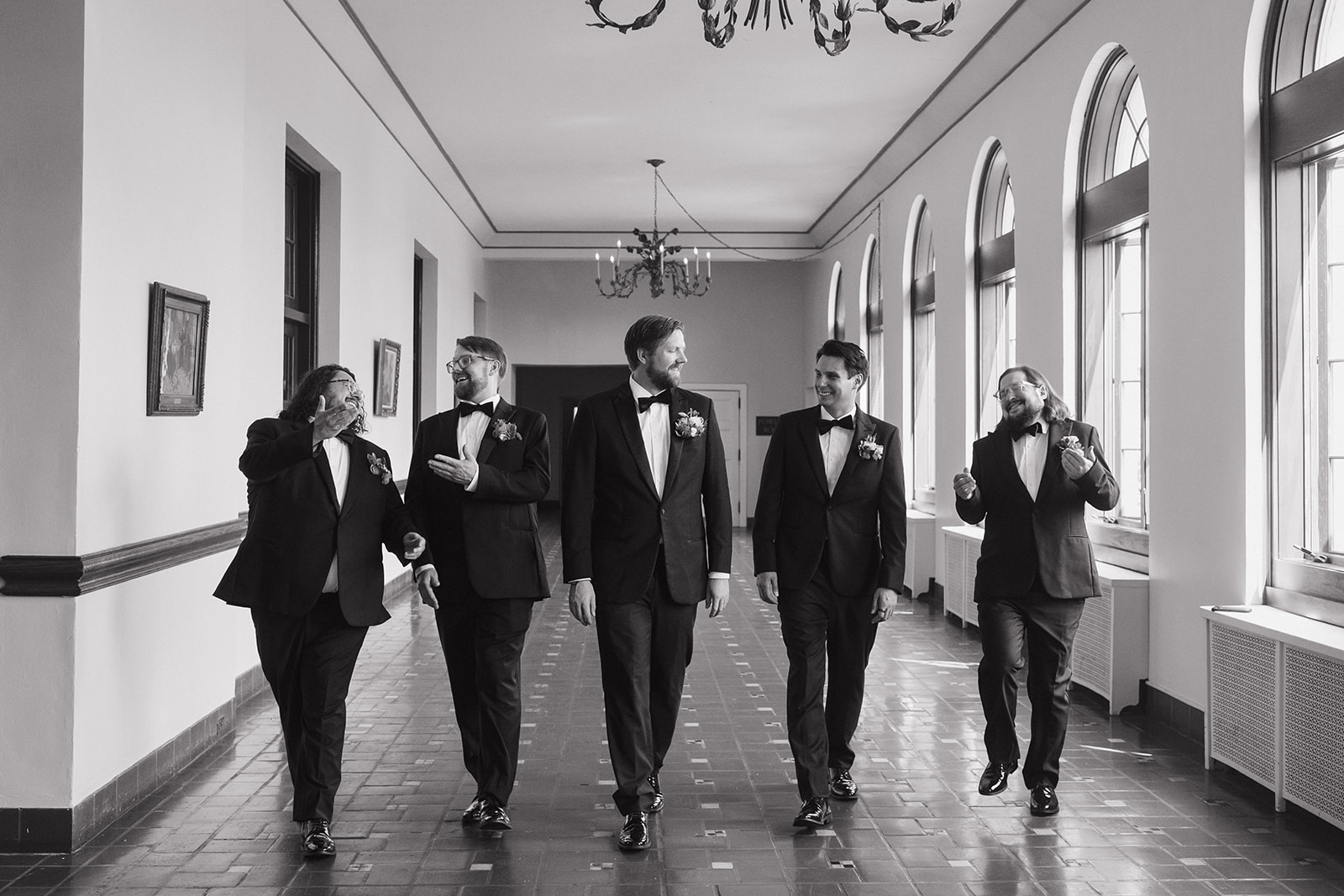 Black and white portrait of a groom and his groomsmen at Detroit Yacht Club.