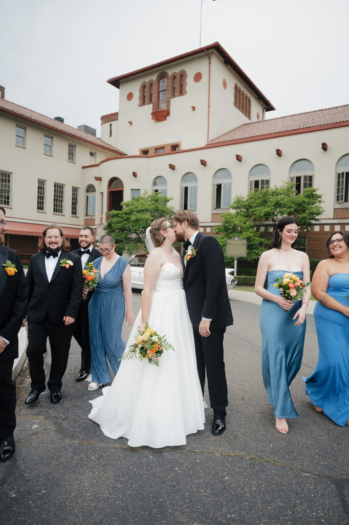 Outdoor wedding party photo outside of Detroit Yacht Club.