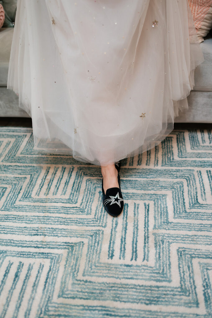 Bride wearing black star shoes with her wedding dress for a Ferndale Michigan wedding.