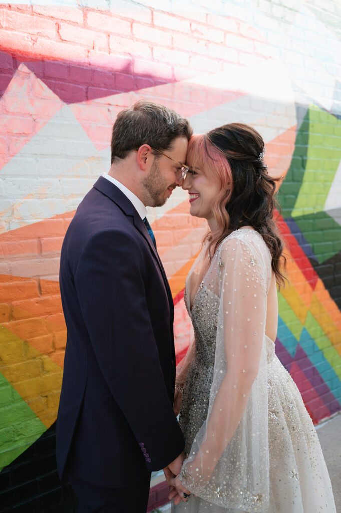 Bride and groom laughing while touching foreheads during their Ferndale Michigan wedding photos.