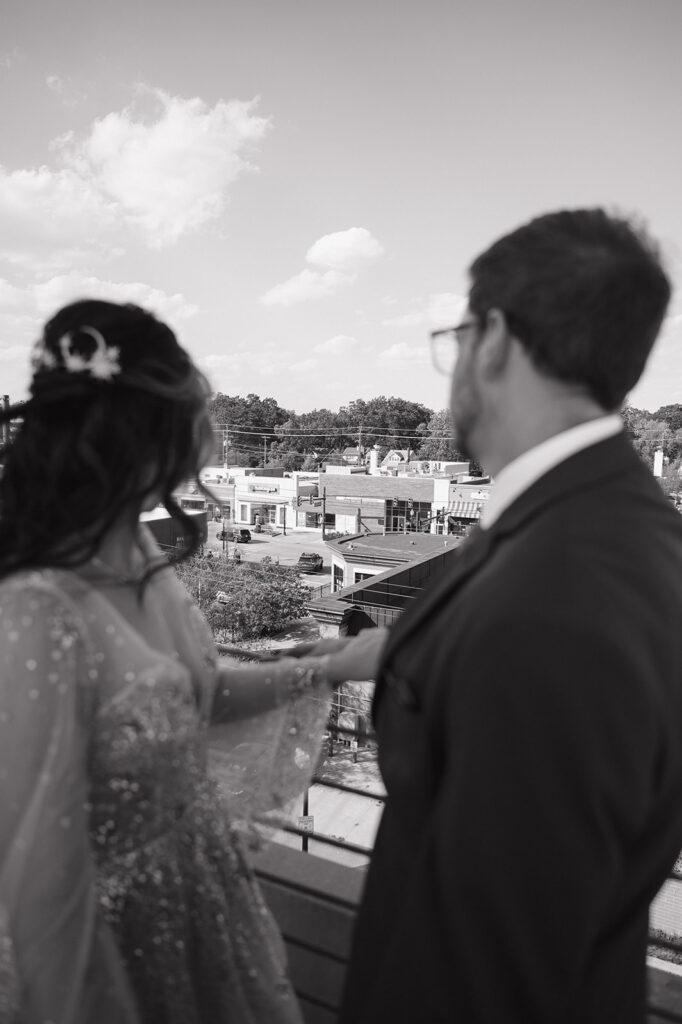 Bride and groom looking out over Ferndale during black and white wedding portraits.