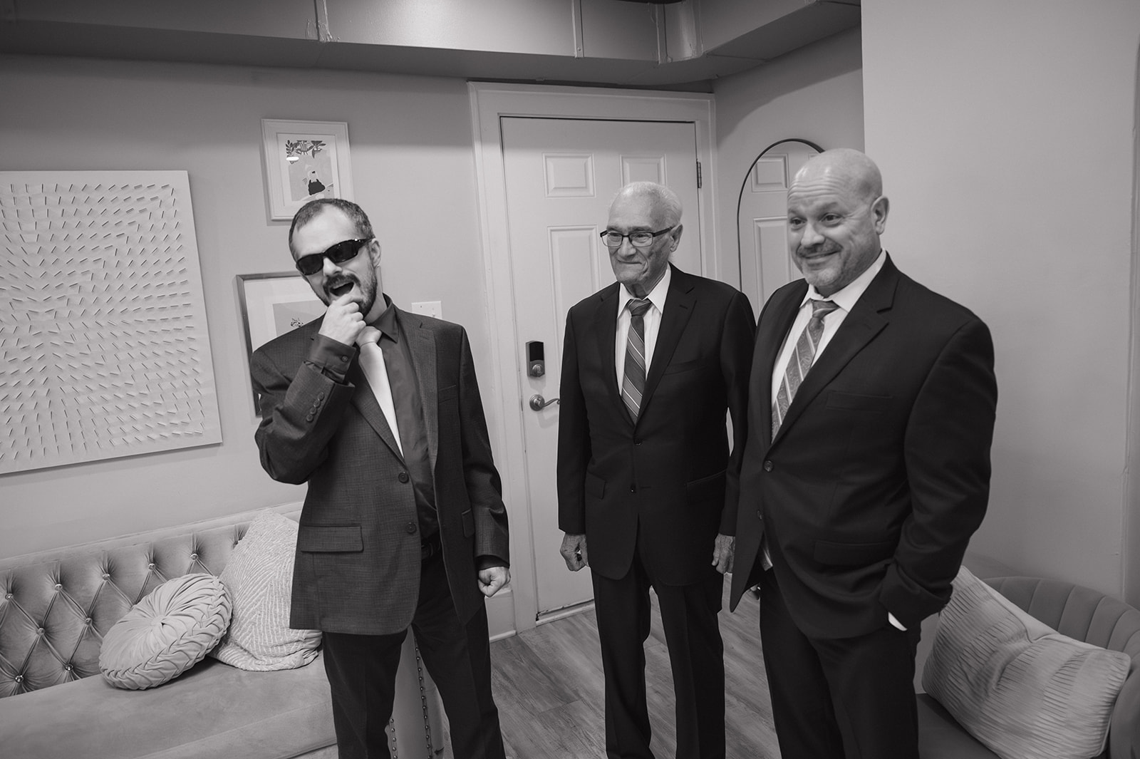 Black and white photo of the brides family seeing her for the first time.