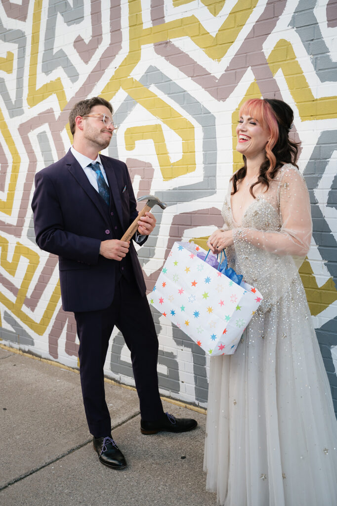 Bride laughing after giving the groom her gift.