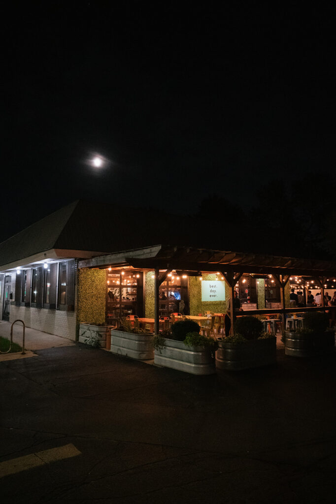Exterior shot of Detroit Fleat lit up at night.