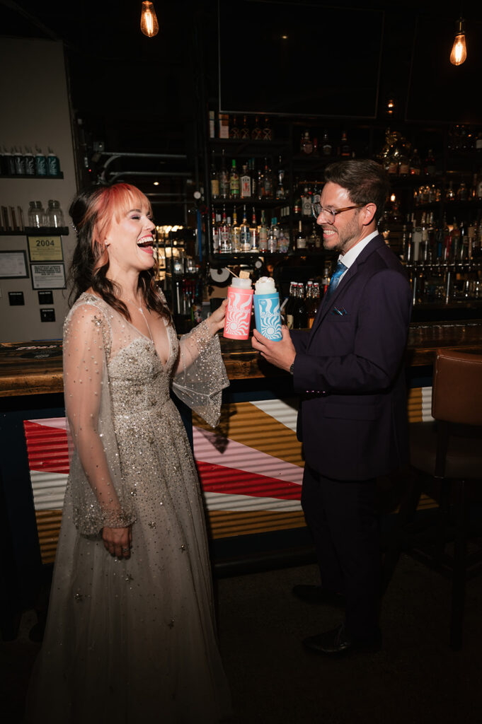Bride and groom drinking custom slooshies during their Ferndale Michigan wedding reception.