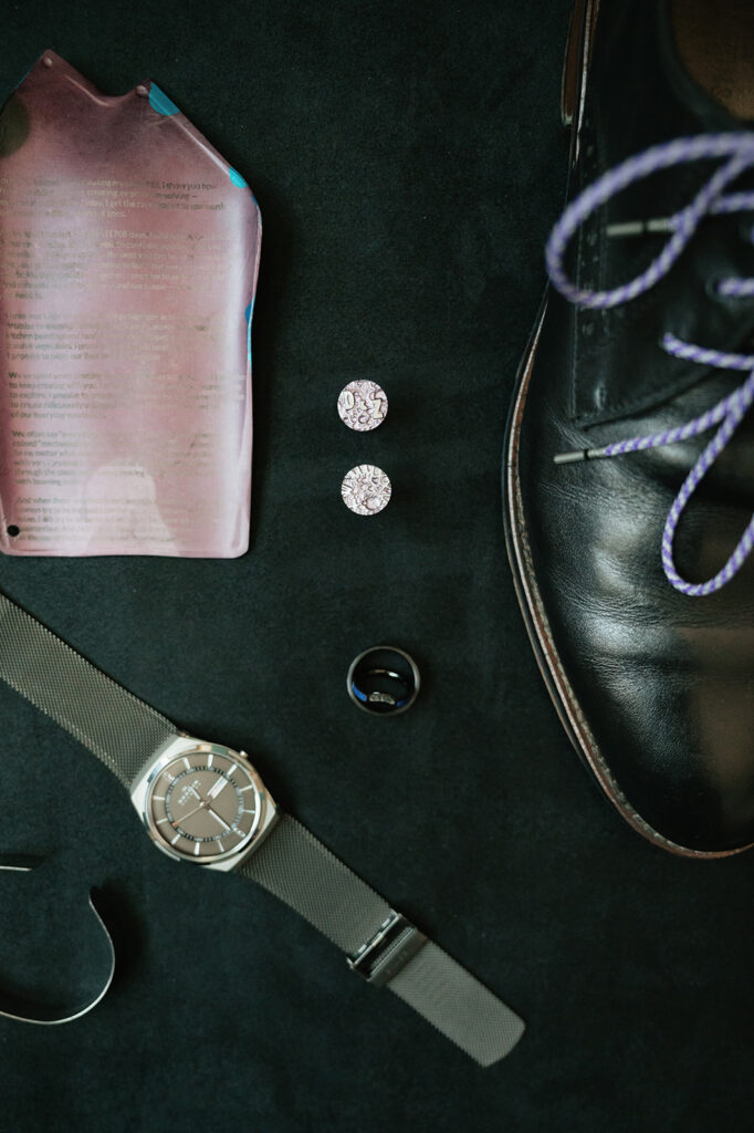 Groom details black wedding shoes, cufflinks, and watch for a Ferndale Michigan wedding.