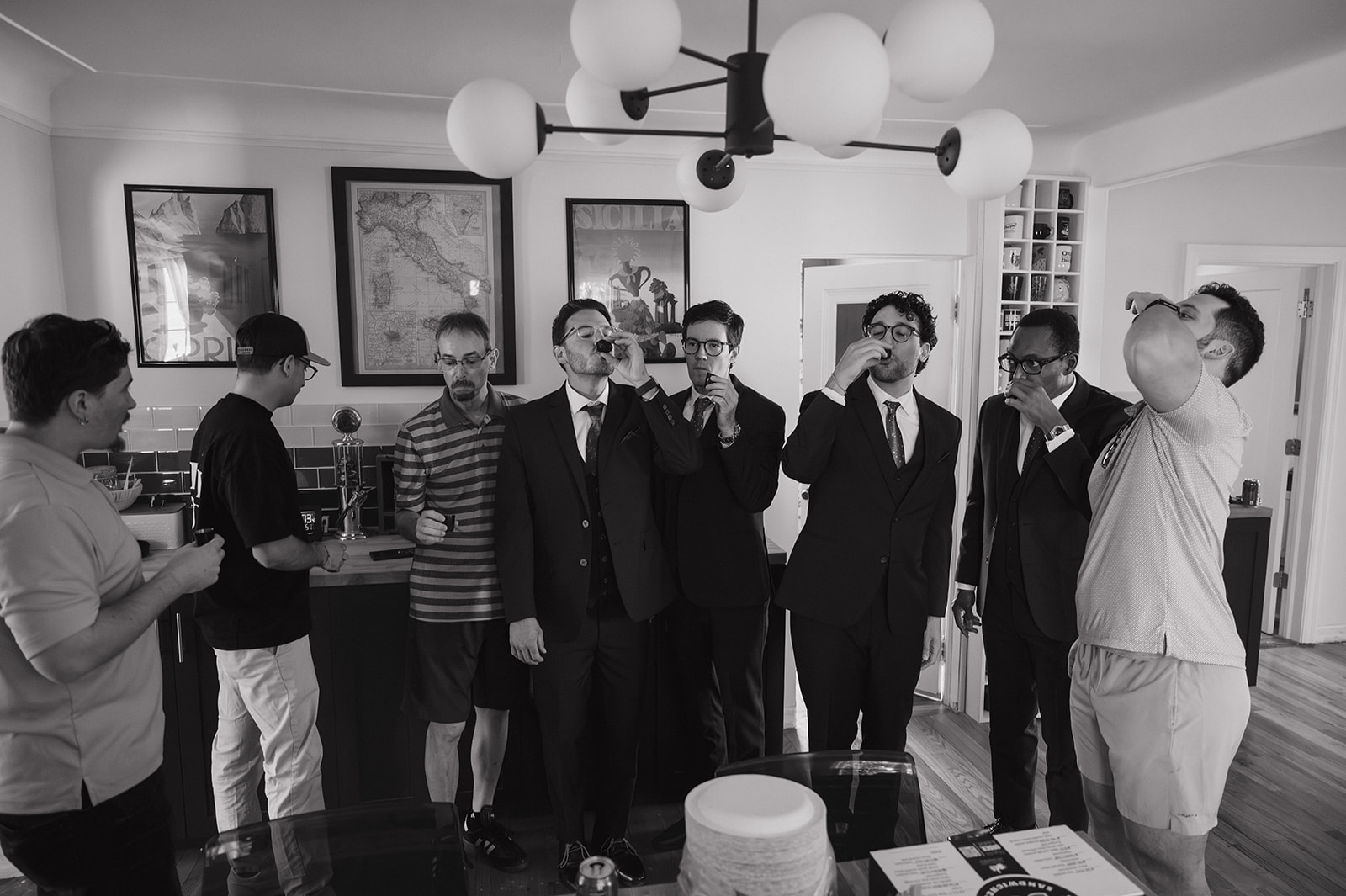 Groom and groomsmen taking shots while getting ready before a Ferndale Michigan wedding.