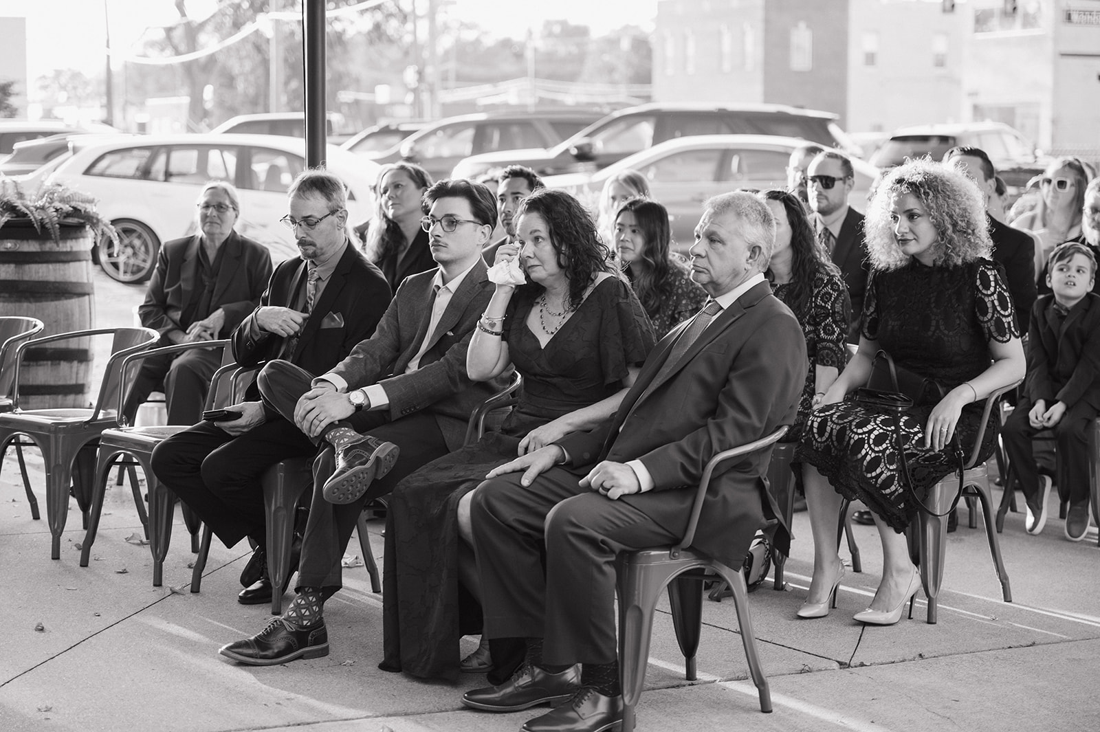 Wedding guests getting emotional while watching an outdoor ceremony at Detroit Fleat in Ferndale, Michigan.