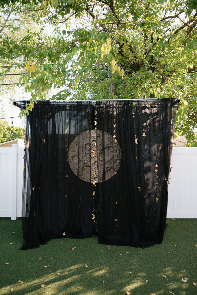 Space-themed moon ceremony backdrop for a Ferndale Michigan wedding at Detroit Fleat.