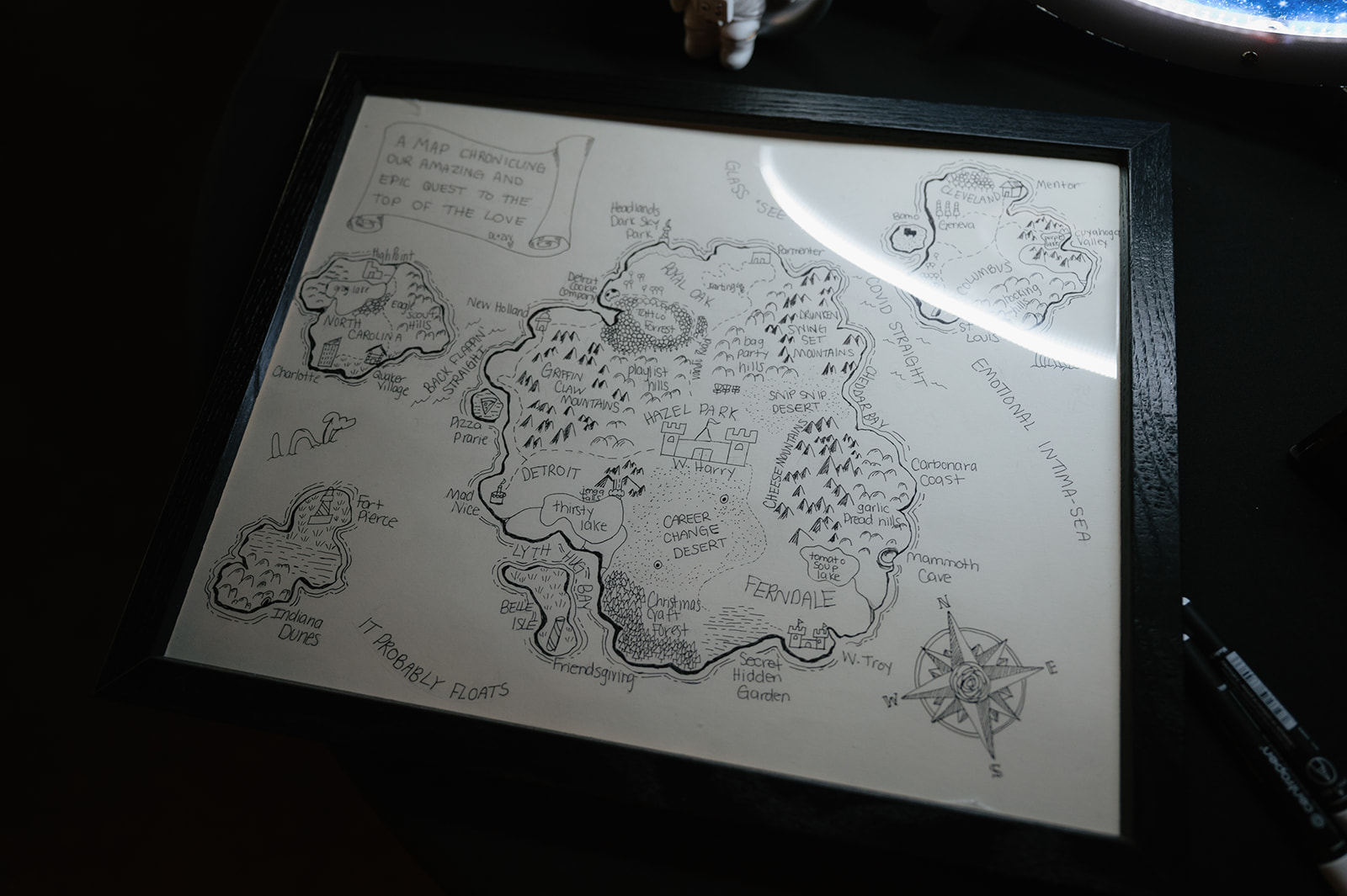 Hand-drawn wedding map titled “a map chronicling our amazing and epic quest to the top of the love.”