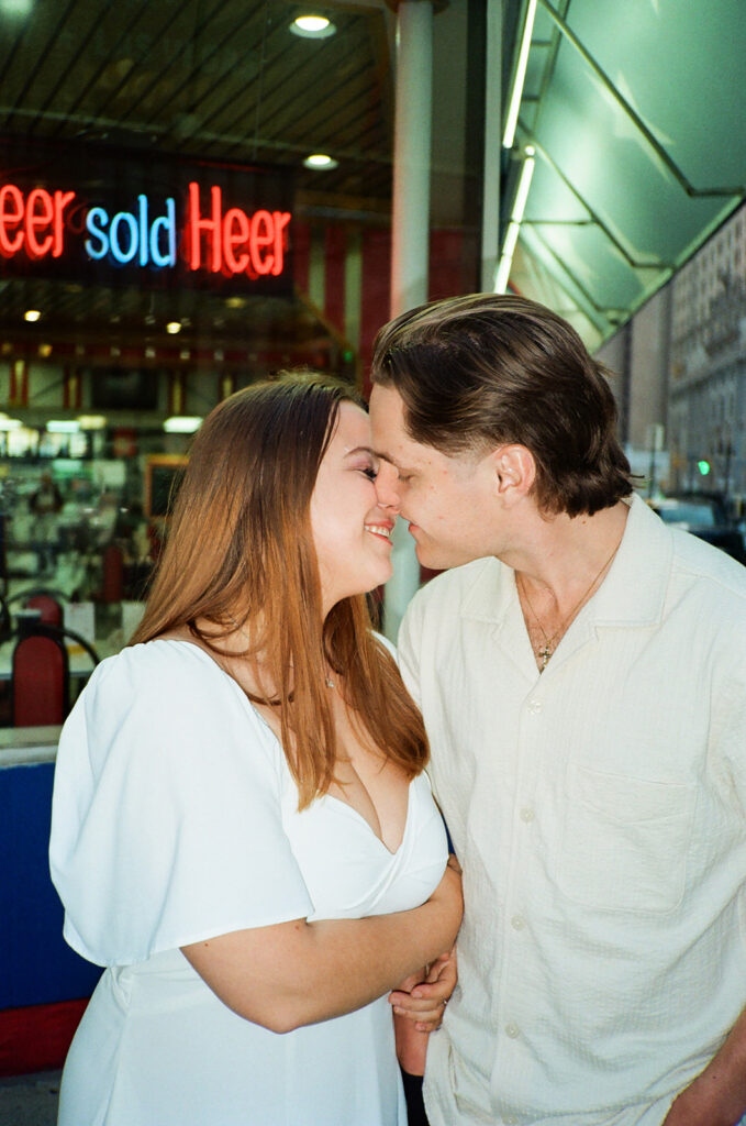 Couple posing outside of American Coney Dog on 35mm film.