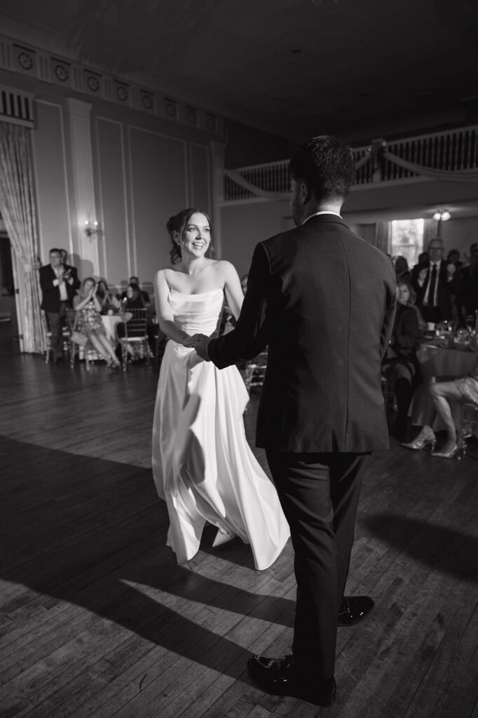 Bride and groom dancing during their Metro Detroit wedding reception at Meeting House Grand Ballroom in Plymouth.