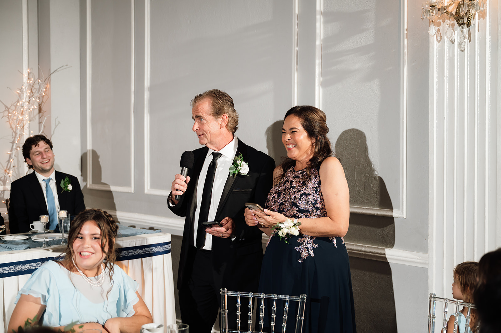 Grooms parents giving a speech during the reception.