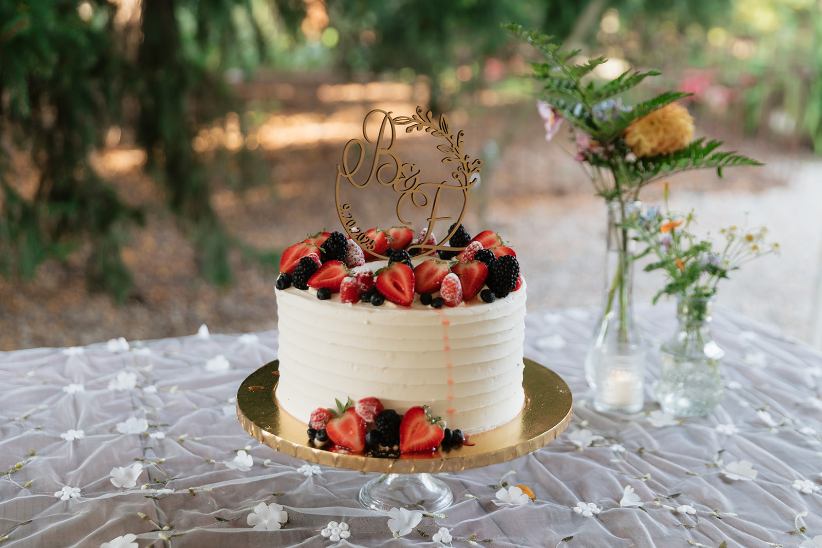 Bride and grooms berry topped wedding cake. 