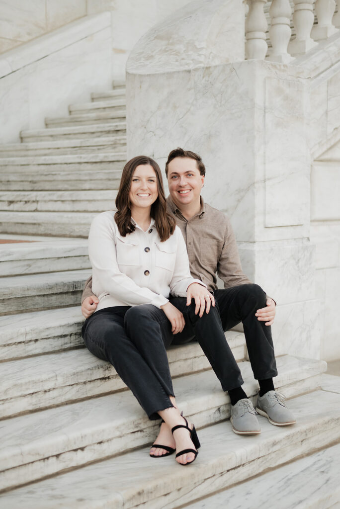 Couple sitting on the stairs outside of The Detroit Institute of Arts. 