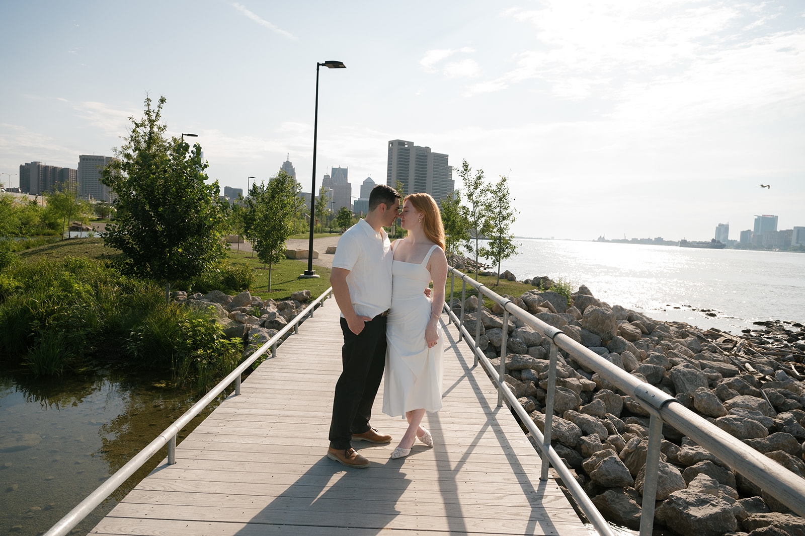 Couple on the Detroit Riverwalk for their engagement photos.