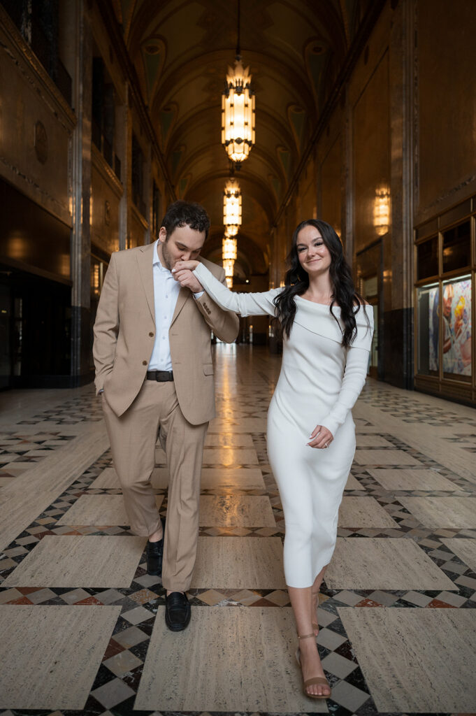 Couple walking inside Fisher Building for their Detroit engagement photos.