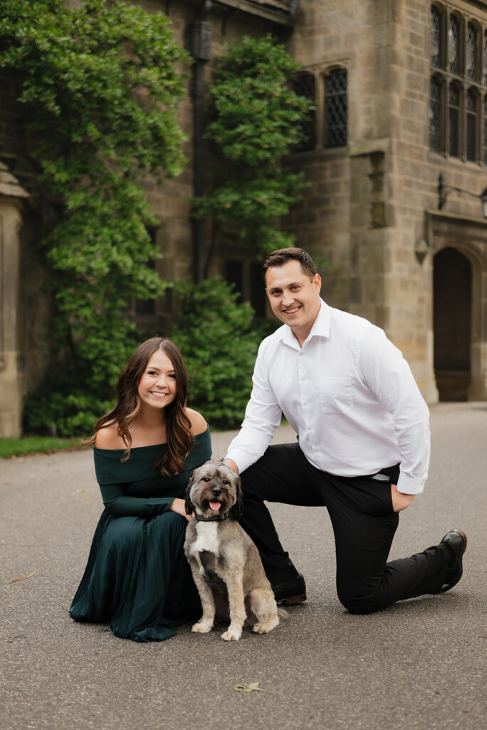 Couple posing with their dog during their Ford House engagement photos in Grosse Pointe Shores, Michigan.