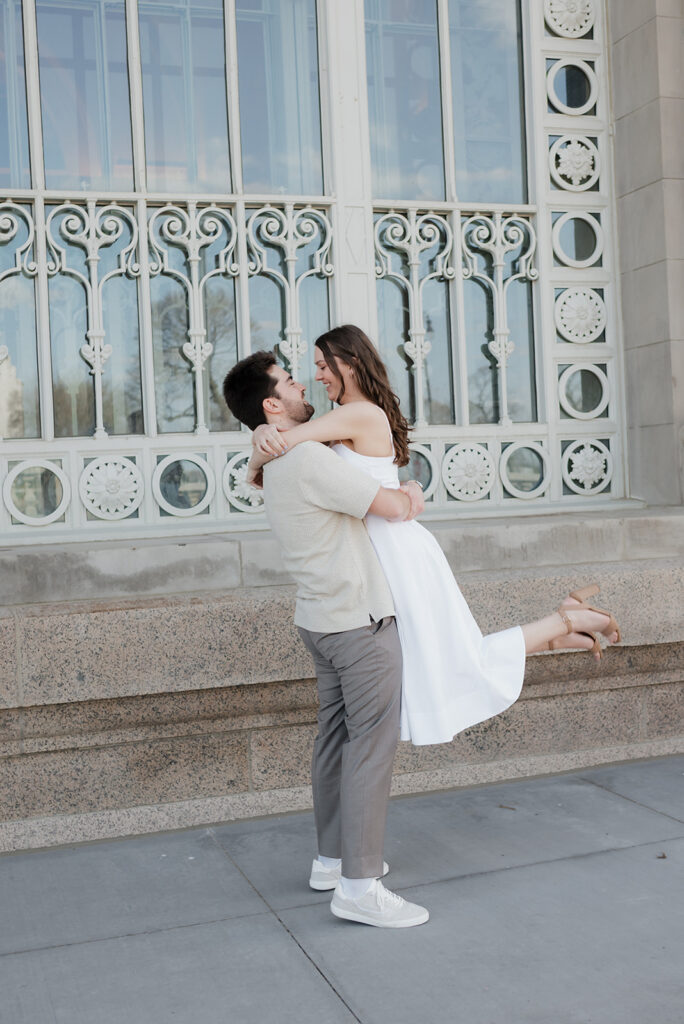 Man lifting his fiancé.