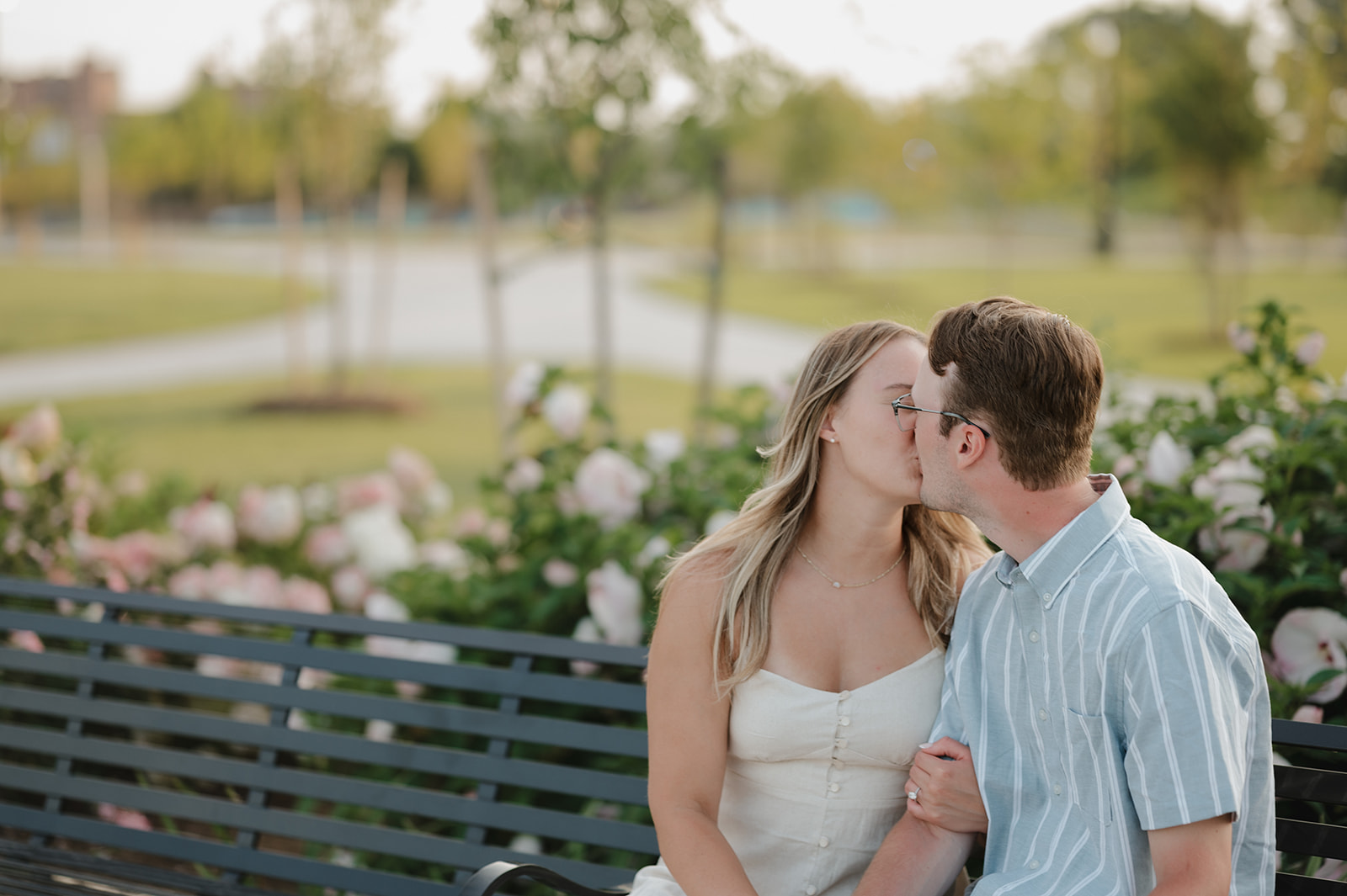 Couple kissing outside of Michigan Central Station for their Detroit engagement photos.