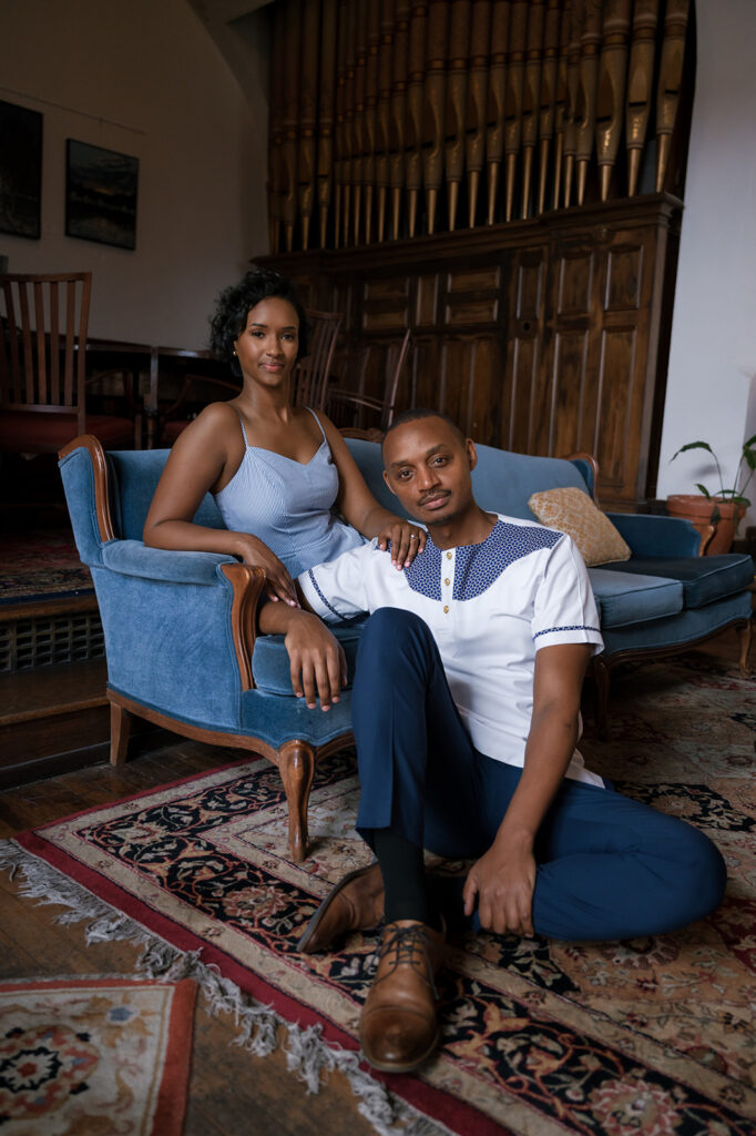 Couple posing for their Detroit engagement photos inside The Congregation. 